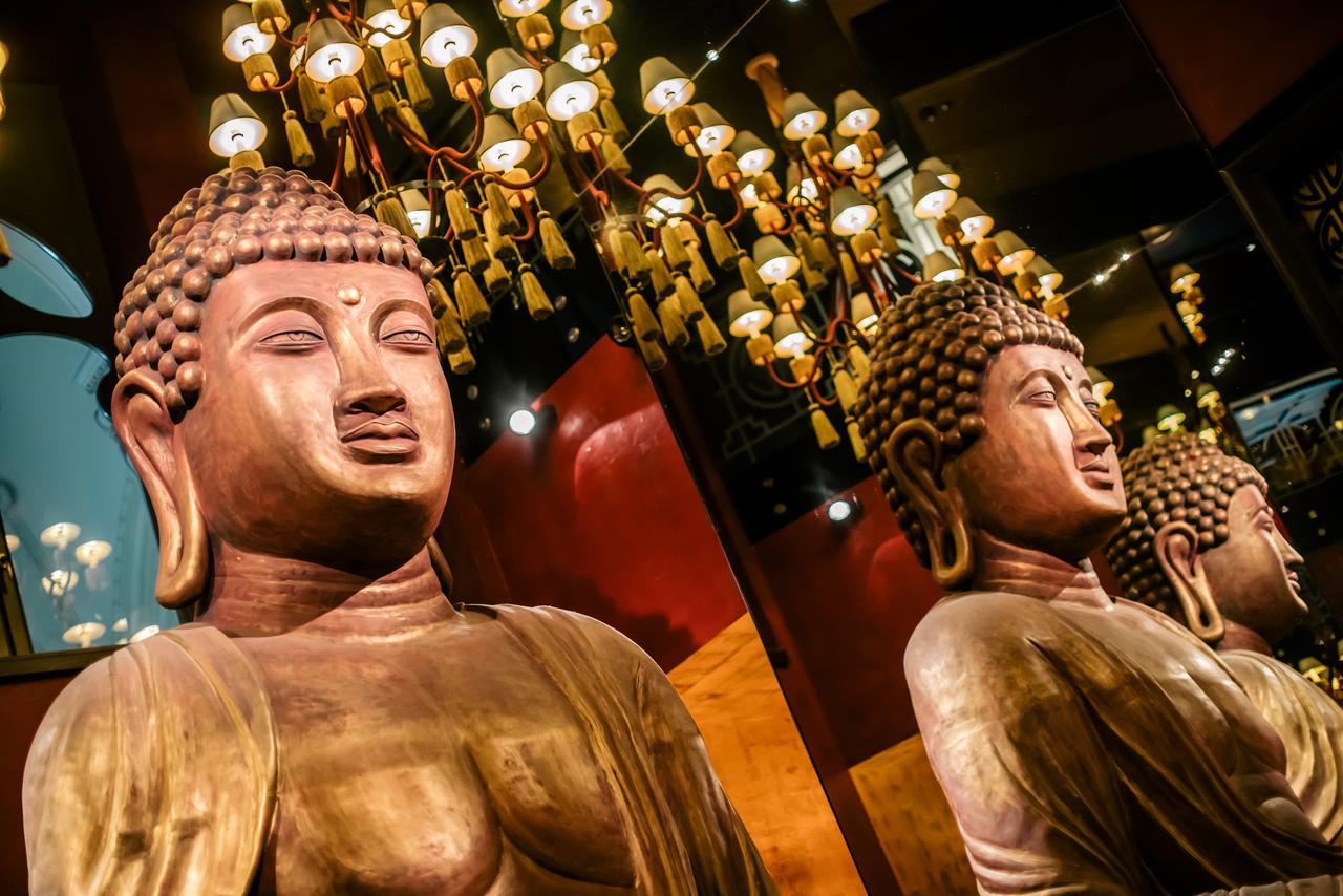 Buddha-Bar Hotel Budapest Klotild Palace Exterior photo The Buddha statues at the entrance of the hotel